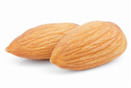 simsearch:400-06520688,k - Closeup of two almond nuts isolated on white Stock Photo - Budget Royalty-Free & Subscription, Code: 400-06360538