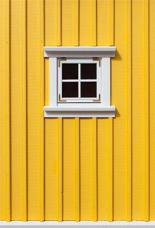 summerhouse - Bright yellow timber wall with a small window Photographie de stock - Aubaine LD & Abonnement, Code: 400-06361371