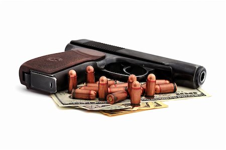 pistol, cartridges and dollars on a white background Stock Photo - Budget Royalty-Free & Subscription, Code: 400-06362638