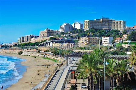 TARRAGONA, SPAIN - NOVEMBER 23: Miracle Beach and panoramic view of the city on November 23, 2011 in Tarragona, Spain. This beach, the closest to downtown, is 980 meters long and 52 meters wide Stock Photo - Budget Royalty-Free & Subscription, Code: 400-06362677