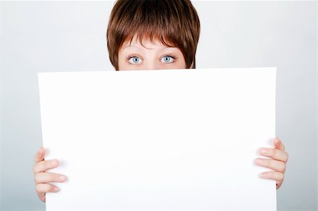 eye background for banner - young girl hiding behind a white banner Stock Photo - Budget Royalty-Free & Subscription, Code: 400-06362882