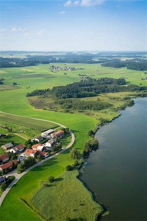 picture of house with high grass - An image of a flight over the bavarian landscape Stock Photo - Budget Royalty-Free & Subscription, Code: 400-06363581