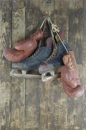 old boxing  and and hockey skates pendant on peg Stock Photo - Budget Royalty-Free & Subscription, Code: 400-06363627