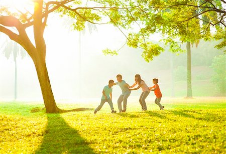 family healthy candid - Happy Asian family playing together at outdoor park Stock Photo - Budget Royalty-Free & Subscription, Code: 400-06363767