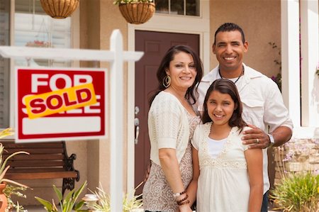 Hispanic Mother, Father and Daughter in Front of Their New Home with Sold Home For Sale Real Estate Sign. Stock Photo - Budget Royalty-Free & Subscription, Code: 400-06384253