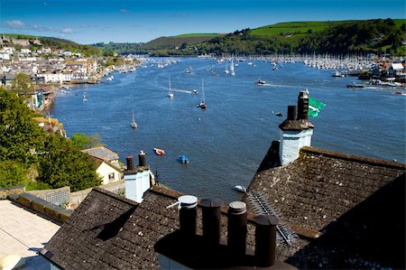 dartmouth - The historic town of Dartmouth in Devon and the River Dart.  Dartmouth is on the left and across the river is Kingswear.  Dartmouth is home to the Royal Navy Navy College and very popular with holiday makers and tourists Stock Photo - Budget Royalty-Free & Subscription, Code: 400-06385300