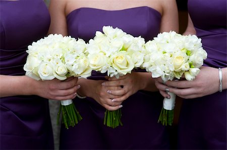 three bridesmaids holding wedding bouquets of roses Stock Photo - Budget Royalty-Free & Subscription, Code: 400-06387368