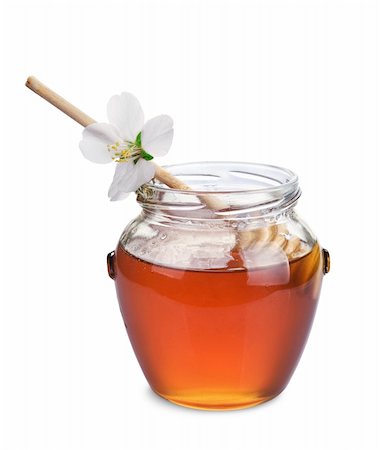 simsearch:400-06387884,k - Honey with wood stick and flowers isolated on white background Stock Photo - Budget Royalty-Free & Subscription, Code: 400-06387881