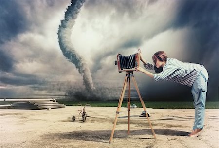 woman, taking photo by vintage camera and tornado (Photo compilation. Photo and hand-drawing elements combined. The grain and texture added.) Stock Photo - Budget Royalty-Free & Subscription, Code: 400-06387958