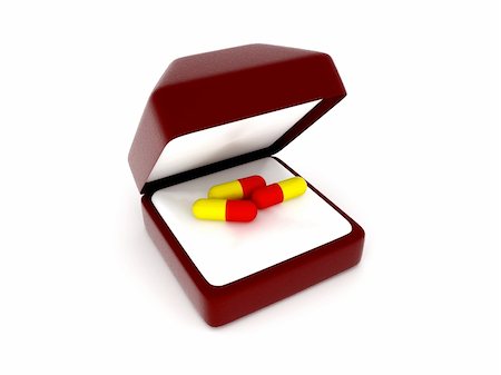 Red and yellow pills in an open red gift box Foto de stock - Royalty-Free Super Valor e Assinatura, Número: 400-06387982