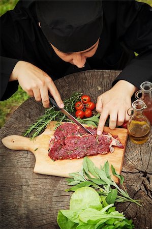 Cooking ingredients: marinated meat,oil,vinegar, herbs and vegetables. Chef is carving and marinating meat. Stock Photo - Budget Royalty-Free & Subscription, Code: 400-06388111