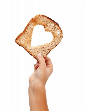simsearch:400-05701644,k - Sharing food with love - child hand with a slice of bread, isolated Stock Photo - Budget Royalty-Free & Subscription, Code: 400-06388304