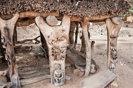 rock art on cliffs - Toguna is a building where men discuss affairs and take important decisions in the toguna. It is a low building in which one cannot stand upright. This helps avoiding violence when discussions get heated. Stock Photo - Budget Royalty-Free & Subscription, Code: 400-06388317