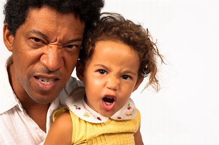 African American dad and his daughter pretendign to be furious Stock Photo - Budget Royalty-Free & Subscription, Code: 400-06388726