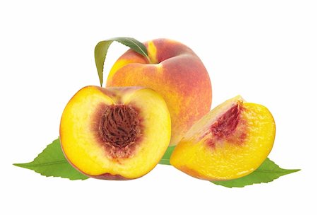 Fresh juicy peaches over green leaves isolated on white background Stock Photo - Budget Royalty-Free & Subscription, Code: 400-06388996