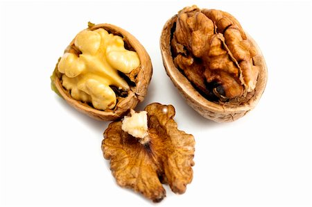 Dry walnuts on a white background Stock Photo - Budget Royalty-Free & Subscription, Code: 400-06389124