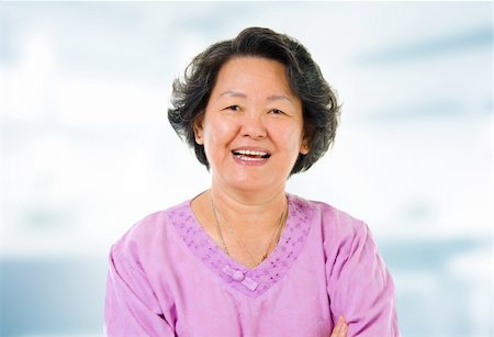 elderly asian faces - 60s cheerful Asian senior woman smiling in home Stock Photo - Budget Royalty-Free & Subscription, Code: 400-06389634