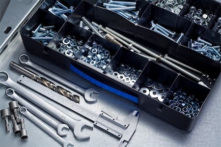 Metal workshop. Plastic toolbox with screws, bolts and some tools. Stock Photo - Budget Royalty-Free & Subscription, Code: 400-06389824