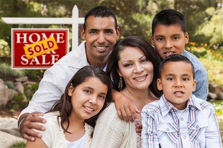 Happy Hispanic Family in Front of Sold Home for Sale Real Estate Sign. Stock Photo - Budget Royalty-Free & Subscription, Code: 400-06394075