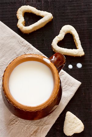 Fresh milk in a ceramic mug and homemade cookies on a linen napkin. Stock Photo - Budget Royalty-Free & Subscription, Code: 400-06394624