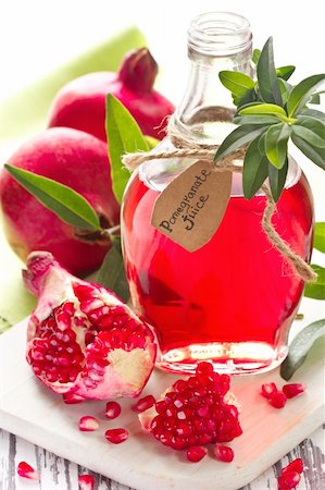 Homemade pomegranate juice and ripe pomegranates on a wooden board. Stock Photo - Budget Royalty-Free & Subscription, Code: 400-06394625