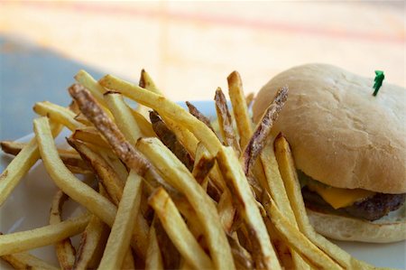 plate of hamburger and fries - Cheeseburger or hamburger with fries on a white plate. Stock Photo - Budget Royalty-Free & Subscription, Code: 400-06394741