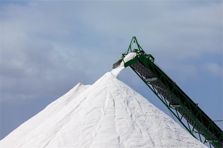 Extraction of salt. Salt mountains on blue sky. Stock Photo - Budget Royalty-Free & Subscription, Code: 400-06394840