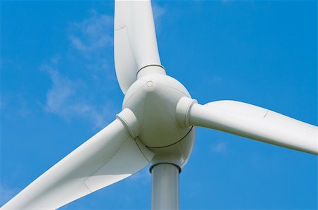 resources of electricity - closeup of a windturbine against a blue sky Stock Photo - Budget Royalty-Free & Subscription, Code: 400-06394939