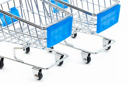 two steel shopping carts with blue handles on white background Stock Photo - Budget Royalty-Free & Subscription, Code: 400-06395265
