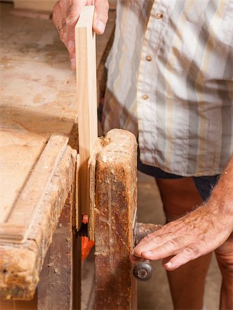 Carpenters hands working on some planks at his work bench Stock Photo - Budget Royalty-Free & Subscription, Code: 400-06395490
