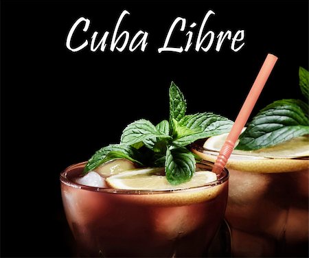 Cuba Libre cocktail on rustic wooden background Stock Photo - Budget Royalty-Free & Subscription, Code: 400-06395944