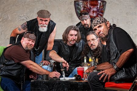 simsearch:400-04278950,k - Tough group of Caucasian biker gang members with weapons Fotografie stock - Microstock e Abbonamento, Codice: 400-06396528