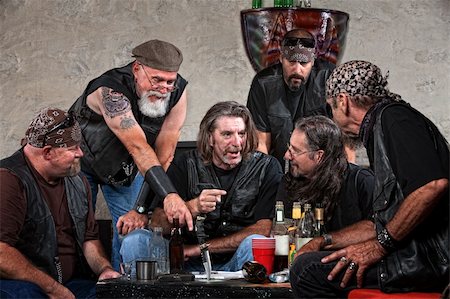 simsearch:400-06396539,k - Biker gang members talking and drinking with weapons Stock Photo - Budget Royalty-Free & Subscription, Code: 400-06396529
