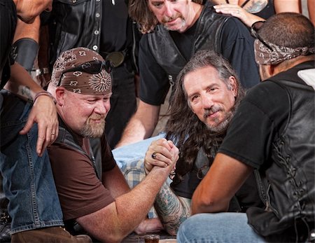 simsearch:400-06396842,k - Tough male gang members in arm wrestling match Stock Photo - Budget Royalty-Free & Subscription, Code: 400-06396545