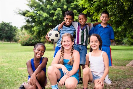 Young boys and sport, portrait of three young children with football looking at camera. Summer camp fun Stock Photo - Budget Royalty-Free & Subscription, Code: 400-06396778