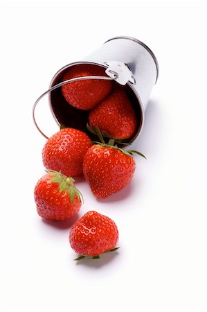 simsearch:400-08020671,k - Ripe Strawberries Spilled from Tin Bucket closeup isolated on white background Stock Photo - Budget Royalty-Free & Subscription, Code: 400-06397164