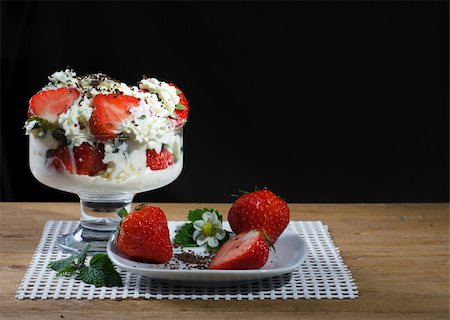 simsearch:400-08251879,k - Fresh strawberry dessert with cream on a wood background Stock Photo - Budget Royalty-Free & Subscription, Code: 400-06397274