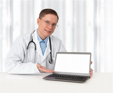 doctor business computer - young doctor in lab coat with laptop Stock Photo - Budget Royalty-Free & Subscription, Code: 400-06390160