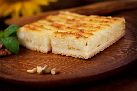 simsearch:400-07461924,k - Cheese pie. Pastry cake with cheese on wooden background. Foto de stock - Super Valor sin royalties y Suscripción, Código: 400-06391107