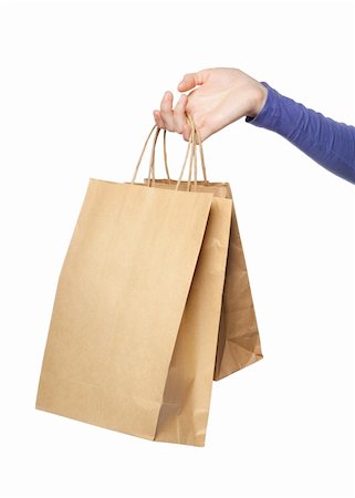 simsearch:400-06092781,k - Deux sacs en papier dans une main de femme isolé sur fond blanc Photographie de stock - Aubaine LD & Abonnement, Code: 400-06391135