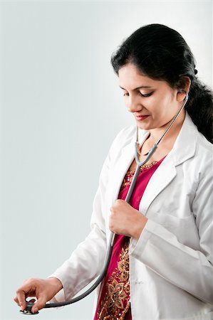 Indian beautiful Friendly lady doctor with stethoscope in sari Stock Photo - Budget Royalty-Free & Subscription, Code: 400-06391406