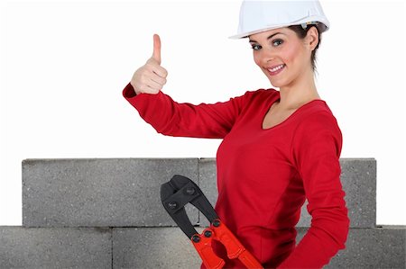 Female bricklayer giving thumbs-up Foto de stock - Super Valor sin royalties y Suscripción, Código: 400-06391476