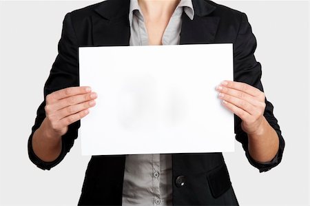 Woman holding a blank paper sheet with both hands Stock Photo - Budget Royalty-Free & Subscription, Code: 400-06391582