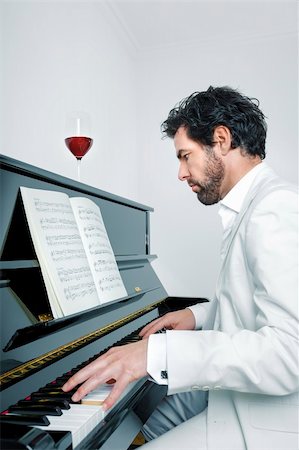 An image of a handsome man playing the piano Stock Photo - Budget Royalty-Free & Subscription, Code: 400-06391759