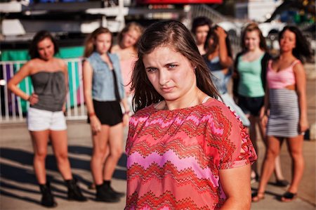 peer pressure - Adolescente européenne sceptique au carnaval avec les amis Photographie de stock - Aubaine LD & Abonnement, Code: 400-06391961