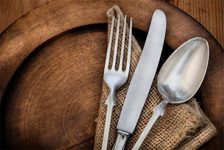 Vintage silverware on rustick wooden plate Stock Photo - Budget Royalty-Free & Subscription, Code: 400-06392103