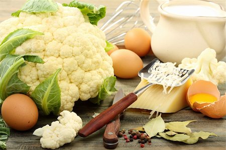 Cauliflower for baking with egg and cheese on a wooden board. Stock Photo - Budget Royalty-Free & Subscription, Code: 400-06393328