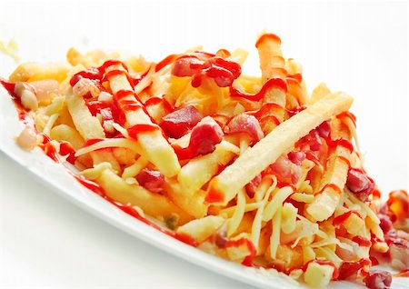 simsearch:400-05084135,k - Delicious french fries with bacon on white background Stock Photo - Budget Royalty-Free & Subscription, Code: 400-06393377