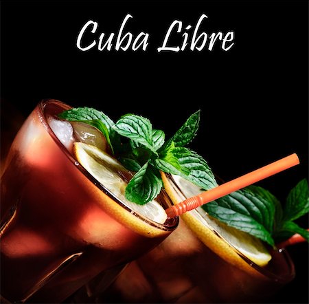 Cuba Libre cocktail on rustic wooden background Stock Photo - Budget Royalty-Free & Subscription, Code: 400-06393384