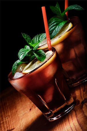 Cuba Libre cocktail on rustic wooden background Stock Photo - Budget Royalty-Free & Subscription, Code: 400-06393385
